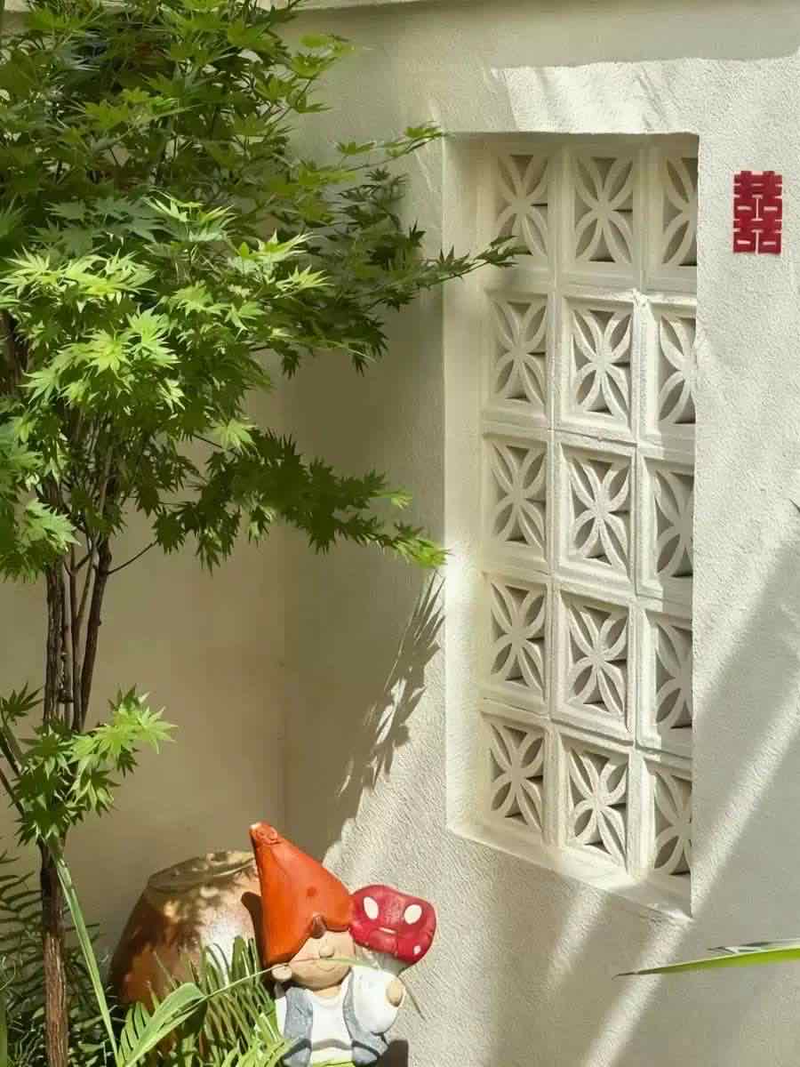 Window grille in garden wall decoration